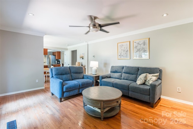 1220 Merribrook Dr, Matthews, NC 28105 - living room featuring ceiling fan, light wood finished floors, ornamental molding, and recessed lighting