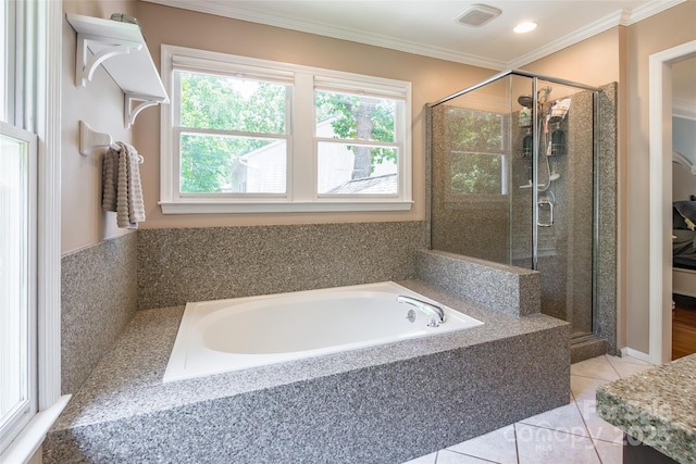 1220 Merribrook Dr, Matthews, NC 28105 - bathroom with plenty of natural light, a garden tub, a stall shower, ornamental molding, and tile patterned flooring