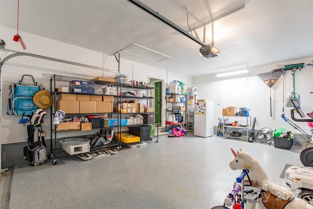 1220 Merribrook Dr, Matthews, NC 28105 - garage with a garage door opener, freestanding refrigerator, gas water heater, and electric panel