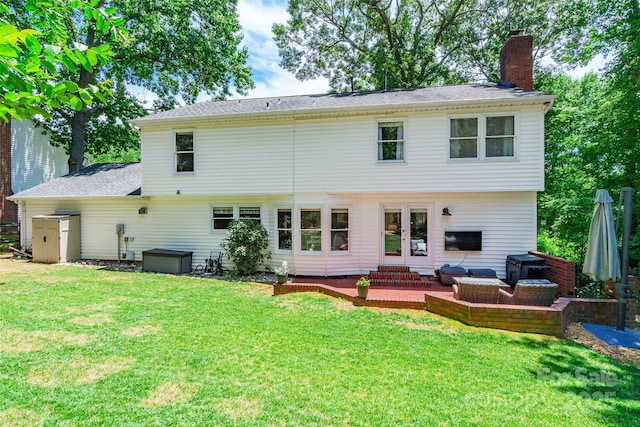 1220 Merribrook Dr, Matthews, NC 28105 - rear view of house featuring a chimney, a lawn, and a patio area