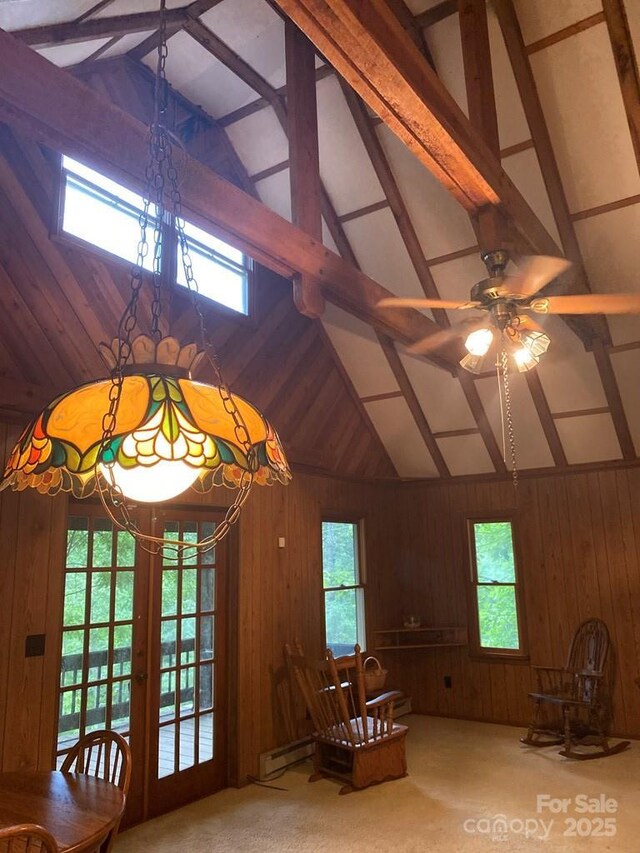 268 Poor Boy Ln, Whittier, NC 28789 - unfurnished room featuring beamed ceiling, wooden walls, a ceiling fan, a chandelier, and high vaulted ceiling