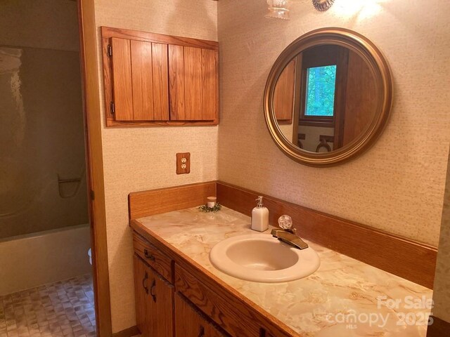 268 Poor Boy Ln, Whittier, NC 28789 - bathroom with vanity, wallpapered walls, and bathing tub / shower combination