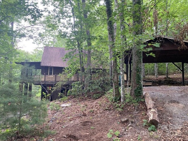 268 Poor Boy Ln, Whittier, NC 28789 - view of yard featuring driveway, a wooden deck, and a carport