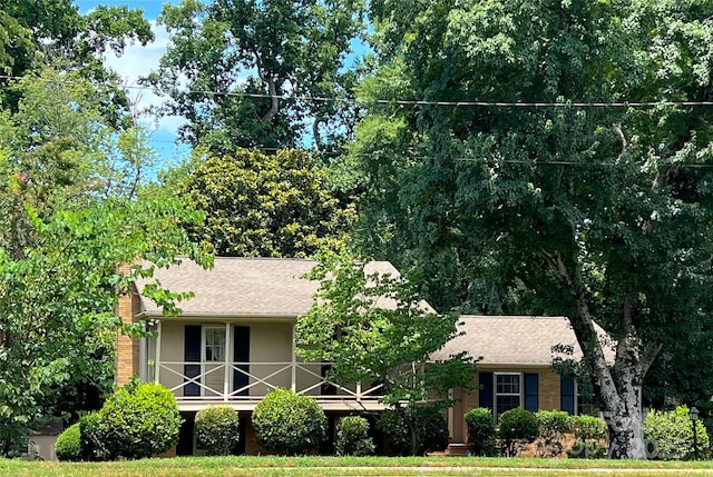 5938 Sharon Rd, Charlotte, NC 28210 - obstructed view of property featuring a porch and roof with shingles