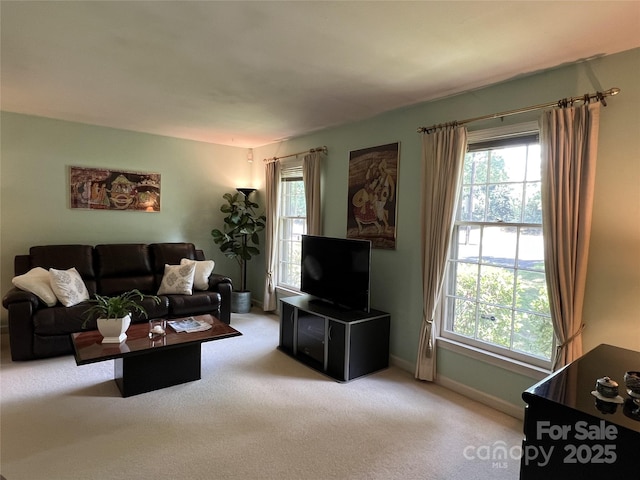 5938 Sharon Rd, Charlotte, NC 28210 - living area with carpet and healthy amount of natural light