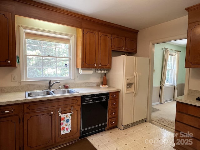 5938 Sharon Rd, Charlotte, NC 28210 - kitchen with black dishwasher, white refrigerator with ice dispenser, plenty of natural light, and light countertops