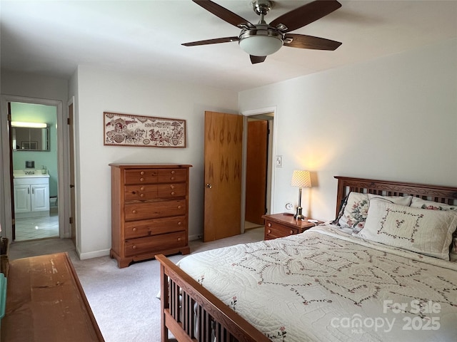 5938 Sharon Rd, Charlotte, NC 28210 - bedroom with light carpet, ensuite bath, and ceiling fan