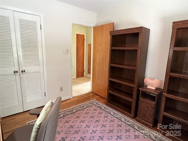 5938 Sharon Rd, Charlotte, NC 28210 - bedroom featuring wood finished floors, a closet, and an office area