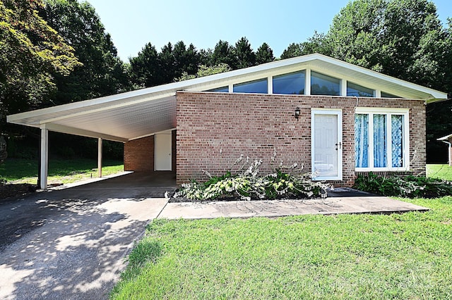 112 Lovelady Rd, Valdese, NC 28690 - view of front of house featuring concrete driveway, brick siding, and a front yard
