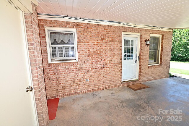 112 Lovelady Rd, Valdese, NC 28690 - view of exterior entry featuring brick siding and a patio area