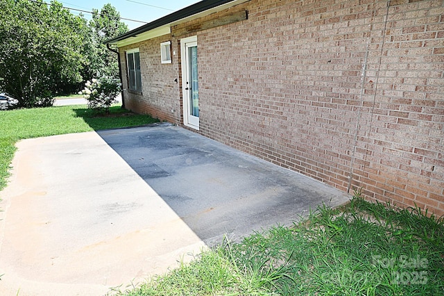 112 Lovelady Rd, Valdese, NC 28690 - view of exterior entry featuring a patio area and brick siding