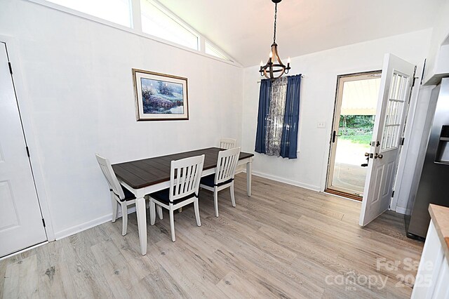 112 Lovelady Rd, Valdese, NC 28690 - dining area featuring a chandelier, light wood finished floors, plenty of natural light, and lofted ceiling