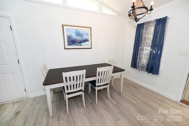 112 Lovelady Rd, Valdese, NC 28690 - dining space featuring a chandelier, light wood-type flooring, and lofted ceiling