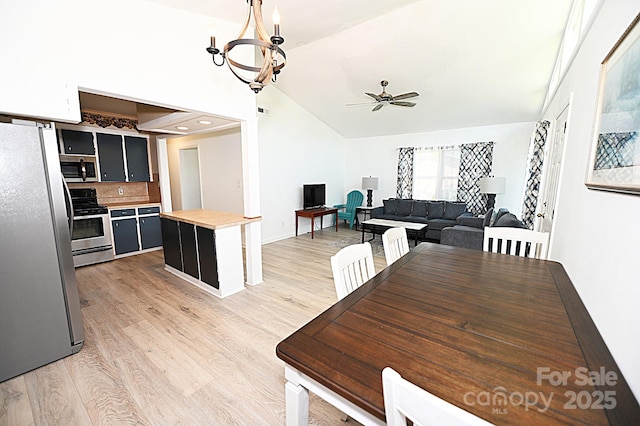 112 Lovelady Rd, Valdese, NC 28690 - dining area with ceiling fan, vaulted ceiling, and light wood-style floors