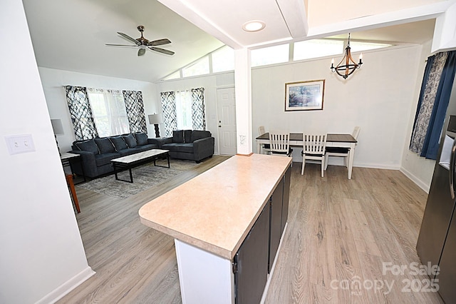 112 Lovelady Rd, Valdese, NC 28690 - living area featuring light wood-style floors, a chandelier, vaulted ceiling, and ceiling fan