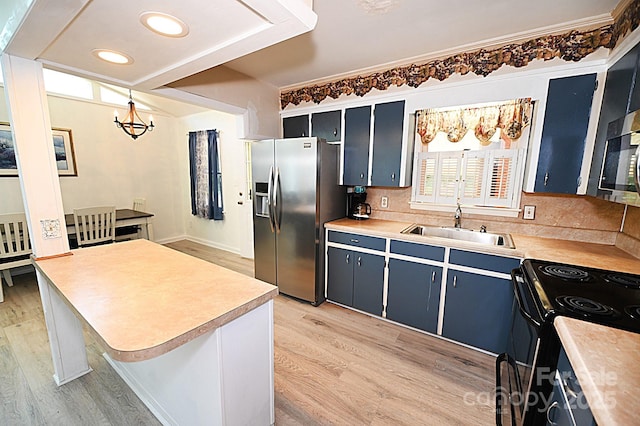 112 Lovelady Rd, Valdese, NC 28690 - kitchen featuring appliances with stainless steel finishes, light wood-style floors, a chandelier, light countertops, and recessed lighting