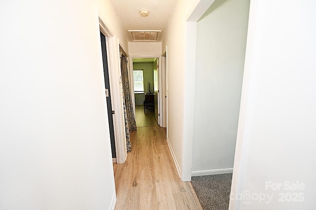 112 Lovelady Rd, Valdese, NC 28690 - corridor with light wood-style flooring and attic access