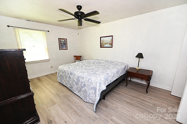 112 Lovelady Rd, Valdese, NC 28690 - bedroom featuring light wood-type flooring, a textured ceiling, and ceiling fan
