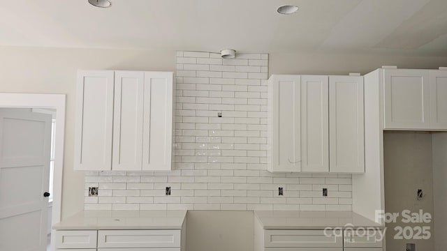 1500 Crowders Creek Rd, Gastonia, NC 28052 - kitchen with tasteful backsplash, white cabinets, and light countertops