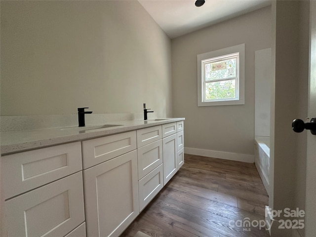 1500 Crowders Creek Rd, Gastonia, NC 28052 - full bathroom featuring wood finished floors, double vanity, and a bathtub