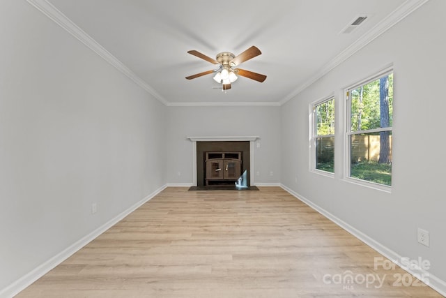 4918 Tyne Dr, Durham, NC 27703 - unfurnished living room with ceiling fan, light wood-type flooring, crown molding, and a fireplace with flush hearth