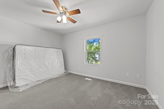 4918 Tyne Dr, Durham, NC 27703 - unfurnished bedroom with carpet flooring and ceiling fan