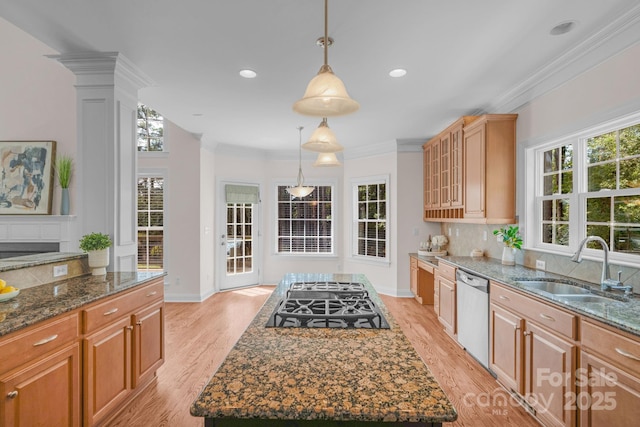 8606 Gresham Dr, Waxhaw, NC 28173 - kitchen with black gas cooktop, stainless steel dishwasher, light wood-style floors, dark stone countertops, and tasteful backsplash