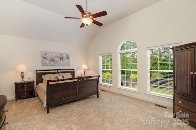 8606 Gresham Dr, Waxhaw, NC 28173 - bedroom with light colored carpet, high vaulted ceiling, and ceiling fan