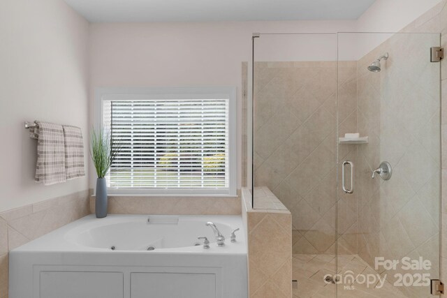 8606 Gresham Dr, Waxhaw, NC 28173 - bathroom featuring a tub with jets and a stall shower