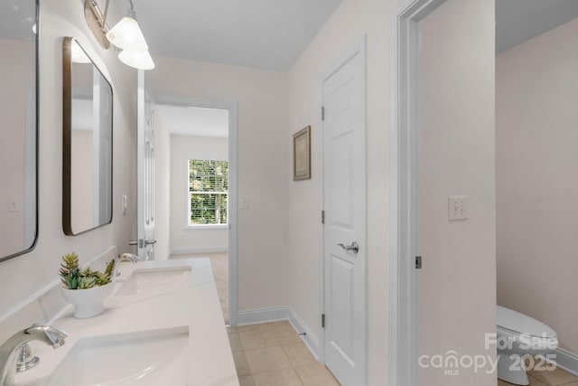 8606 Gresham Dr, Waxhaw, NC 28173 - bathroom featuring double vanity and tile patterned flooring