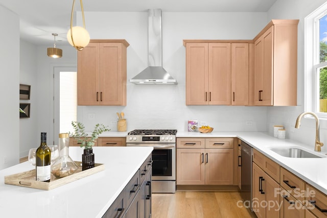 2417 Pruitt St, Charlotte, NC 28208 - kitchen with stainless steel appliances, wall chimney range hood, backsplash, and light countertops
