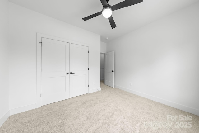 2417 Pruitt St, Charlotte, NC 28208 - unfurnished bedroom with carpet, a closet, and a ceiling fan