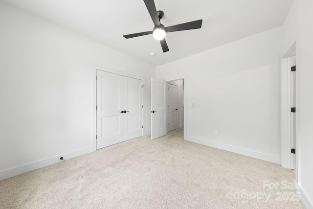 2417 Pruitt St, Charlotte, NC 28208 - unfurnished bedroom with light colored carpet, ceiling fan, and a closet
