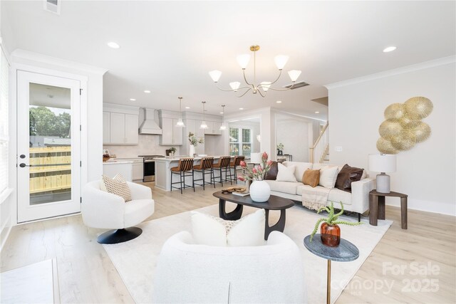4114 Mantle Ct, Charlotte, NC 28205 - living area featuring crown molding, stairs, a chandelier, light wood-style floors, and recessed lighting