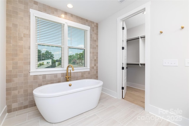 4114 Mantle Ct, Charlotte, NC 28205 - full bathroom with tile walls, a soaking tub, tile patterned flooring, and recessed lighting