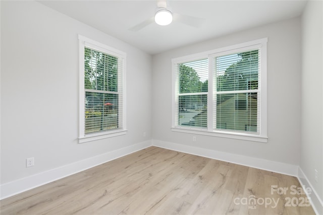 4114 Mantle Ct, Charlotte, NC 28205 - empty room with healthy amount of natural light, wood finished floors, and ceiling fan