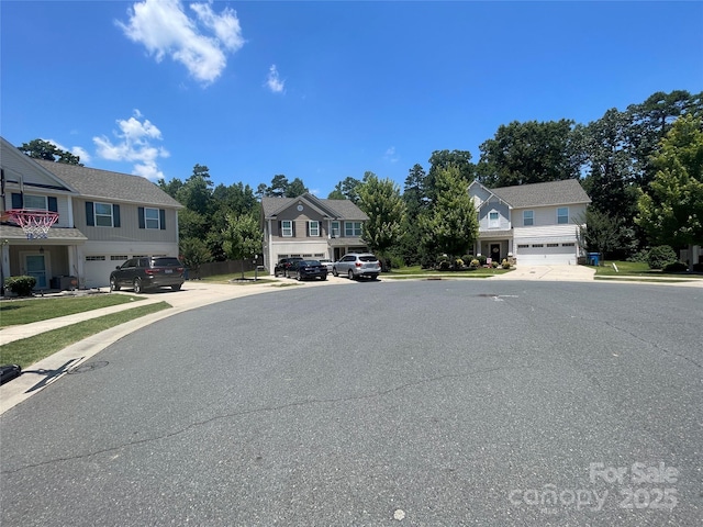 127 Tranquil Ct Unit 18A, Locust, NC 28097 - view of asphalt road with sidewalks, a residential view, and curbs
