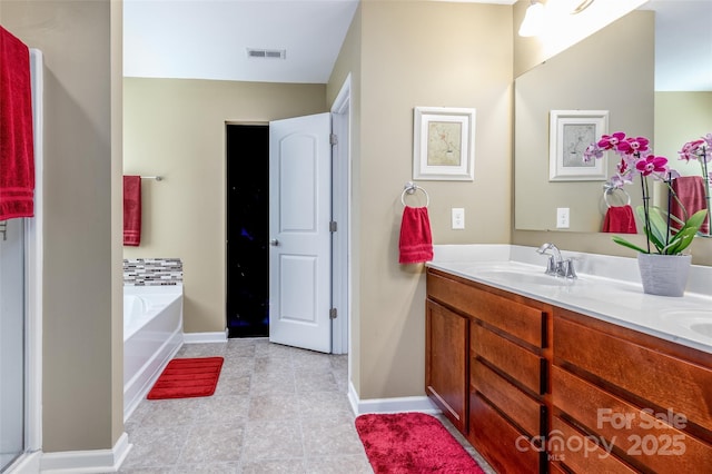 127 Tranquil Ct Unit 18A, Locust, NC 28097 - bathroom with double vanity, a bath, and tile patterned flooring