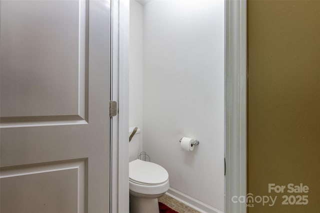127 Tranquil Ct Unit 18A, Locust, NC 28097 - bathroom with toilet and baseboards