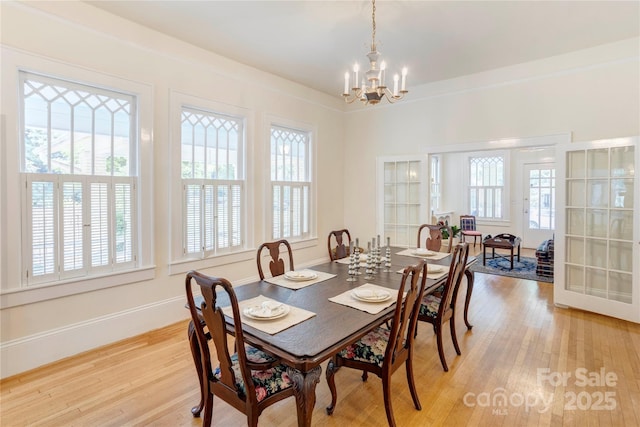 156 Union St N, Concord, NC 28025 - dining space featuring a chandelier, plenty of natural light, and light wood finished floors