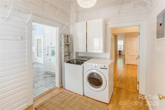 156 Union St N, Concord, NC 28025 - laundry area with washing machine and dryer, cabinet space, light wood-style flooring, and electric panel