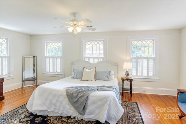 156 Union St N, Concord, NC 28025 - bedroom featuring wood finished floors and ceiling fan