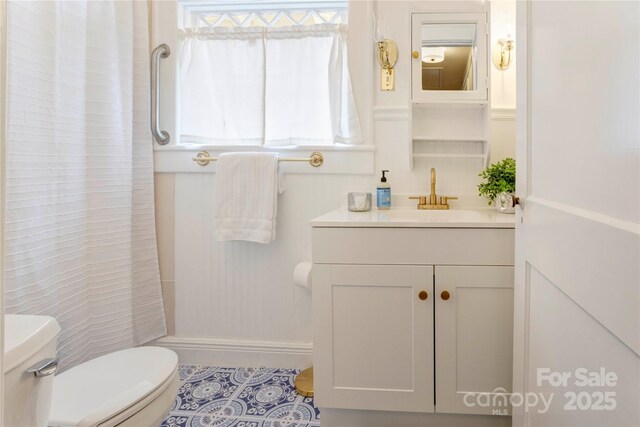 156 Union St N, Concord, NC 28025 - bathroom with vanity, a shower with shower curtain, and tile patterned flooring