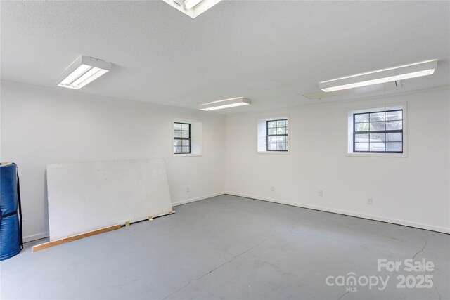 156 Union St N, Concord, NC 28025 - empty room featuring concrete flooring and baseboards