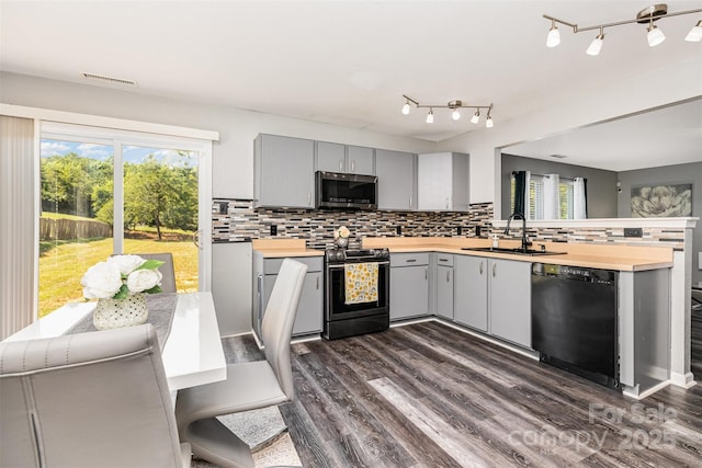 3542 Crowders View Dr, Gastonia, NC 28052 - kitchen with stainless steel appliances, gray cabinets, dark wood-style floors, and backsplash