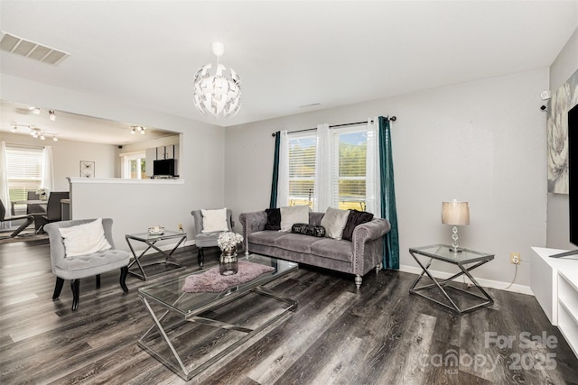 3542 Crowders View Dr, Gastonia, NC 28052 - living room featuring dark wood-type flooring and a chandelier