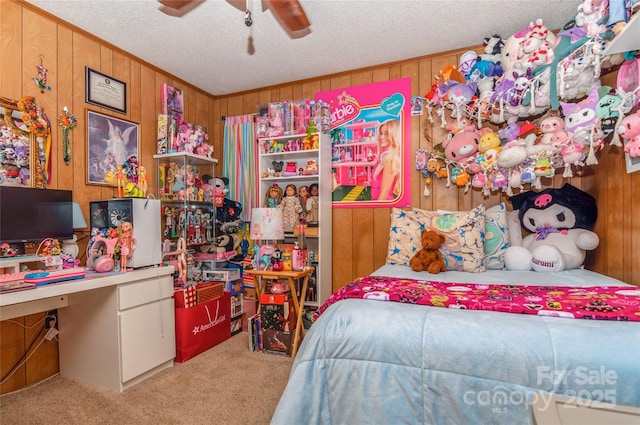 511 E Church St, Kershaw, SC 29067 - carpeted bedroom featuring wood walls, a textured ceiling, a desk, and a ceiling fan