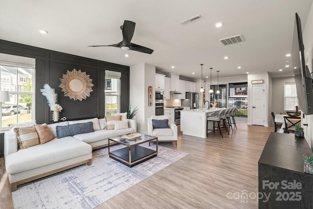 932 Portrush Ln, Tega Cay, SC 29708 - living room with light wood-style floors, ceiling fan, and recessed lighting