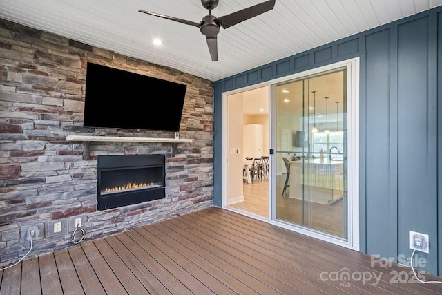 932 Portrush Ln, Tega Cay, SC 29708 - wooden deck featuring a stone fireplace and ceiling fan
