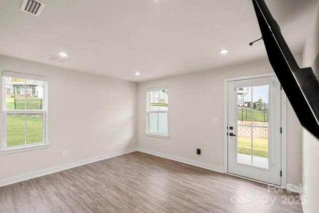 932 Portrush Ln, Tega Cay, SC 29708 - spare room featuring wood finished floors and recessed lighting